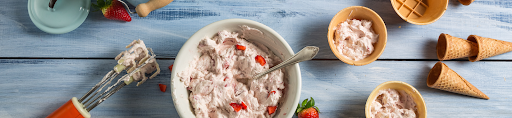 A bowl of Ice Cream 504’s strawberry ice cream made with sugar, milk, and fresh strawberries.